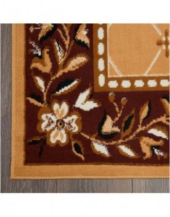 A brown rug with flowers and leaves on it