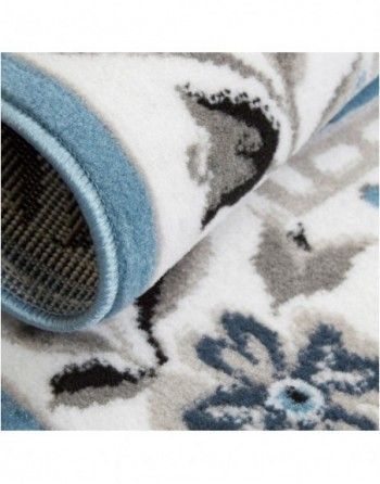 A close up of a rug with a floral pattern on it