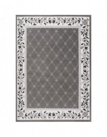 A gray rug with a white floral border on a white background.