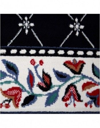 A black and white rug with flowers and leaves on it