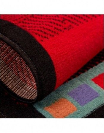 A close up of a red rug with a black border
