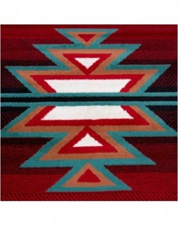 A red rug with a geometric pattern on it