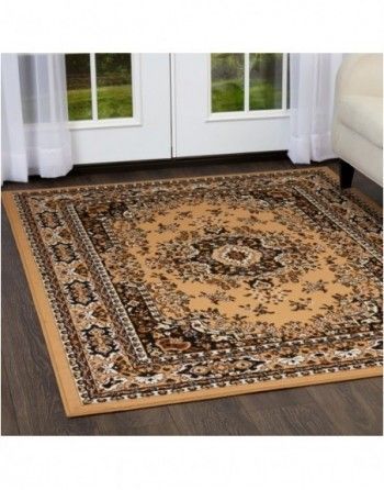 A rug is sitting on the floor in a living room next to a couch.