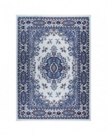 A blue and white rug with a floral pattern on it