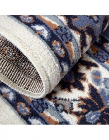 A close up of a rug with a floral pattern on it.