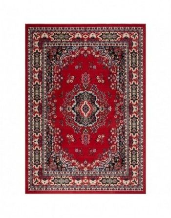 A red rug with a black and white pattern on it