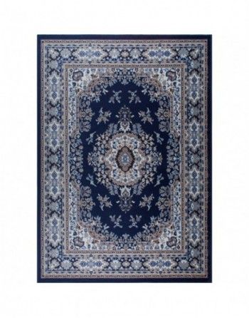 A blue rug with a floral pattern on it