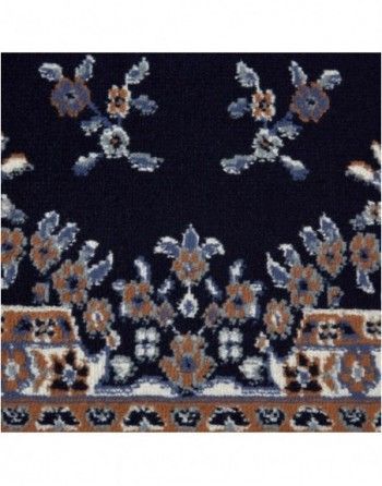 A black rug with a floral pattern on it