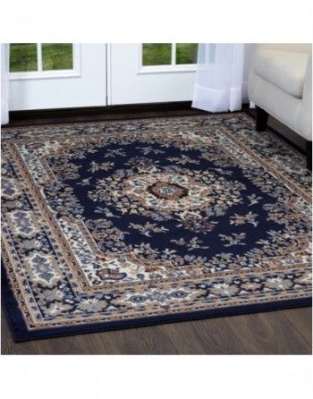 A blue rug is on the floor in a living room