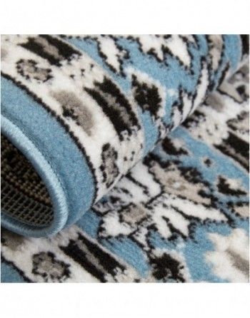 A close up of a blue rug with a pattern on it