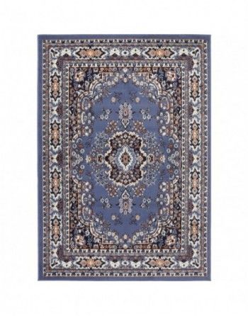 A blue rug with a floral pattern on it