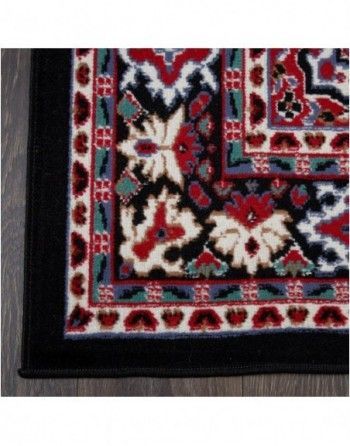A black rug with a floral pattern on it