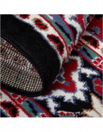 A close up of a colorful rug with a black border