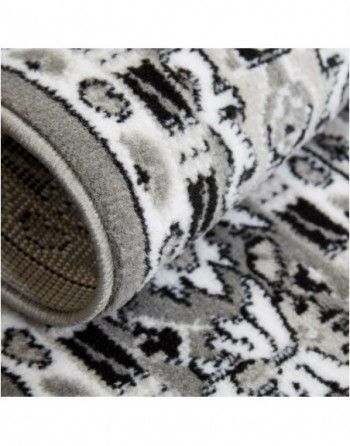 A close up of a black and white rug with a pattern on it.