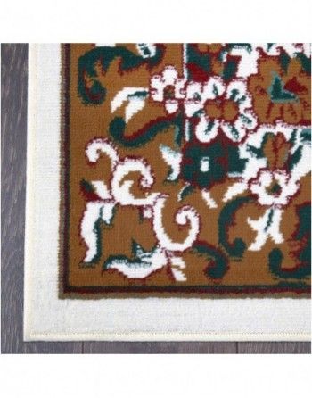 A brown and white rug with a white border is on a wooden floor.