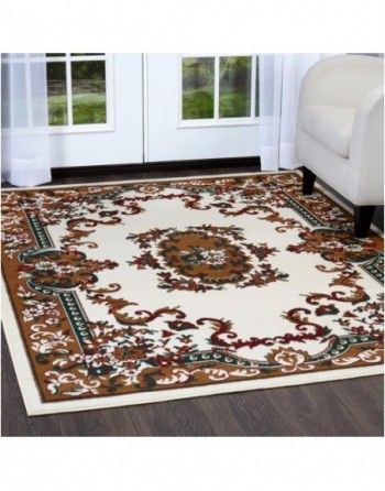 A rug in a living room next to a couch