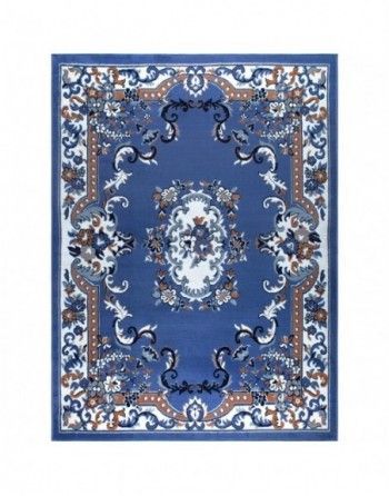 A blue rug with a floral pattern on it