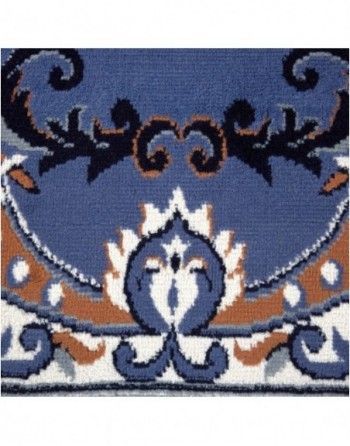 A blue rug with a floral pattern on it