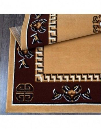 A brown and tan rug with a greek key design