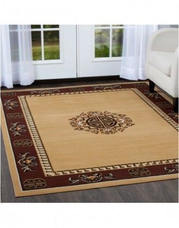 A rug in a living room with a couch in the background