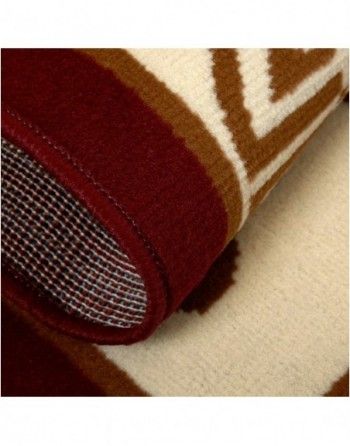 A close up of a rug with a brown and white pattern