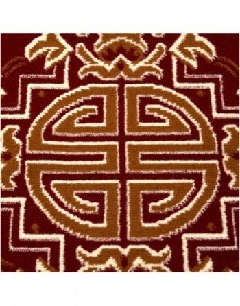 A red and brown rug with a celtic design on it