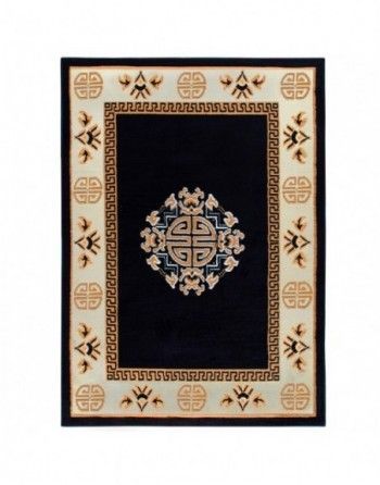 A black rug with a greek key design on it