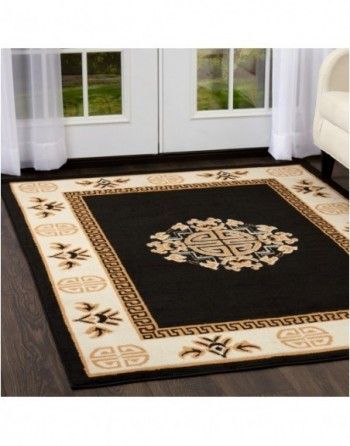 A black and white rug with a greek key design