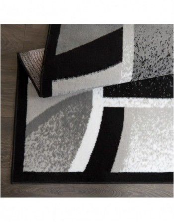 A black and white rug with a black border