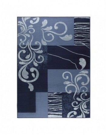 A blue rug with white swirls on it