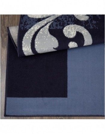 A blue rug with a white swirl on it