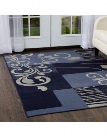 A blue rug is on the floor in a living room
