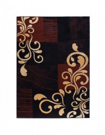 A brown and gold rug with swirls on it