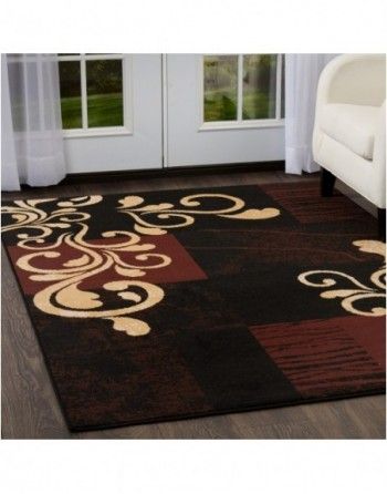 A living room with a rug and a couch