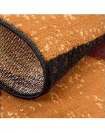 A close up of a brown rug with a black border.