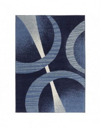 A blue rug with circles and lines on it