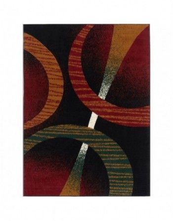 A colorful rug with circles on a black background