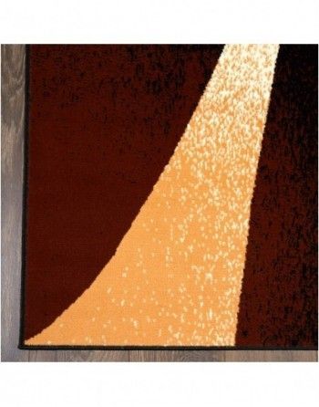 A brown and orange rug with a geometric pattern