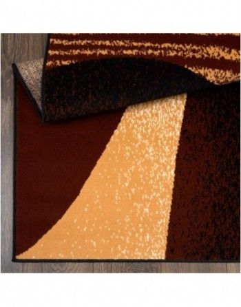 A brown and tan rug with a geometric pattern