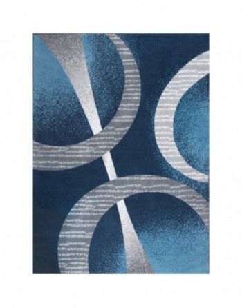 A blue and silver rug with circles on it