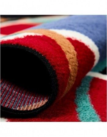 A close up of a colorful rug on a table.