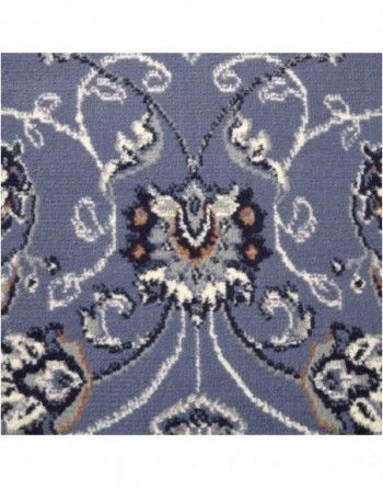 A close up of a blue rug with a floral pattern