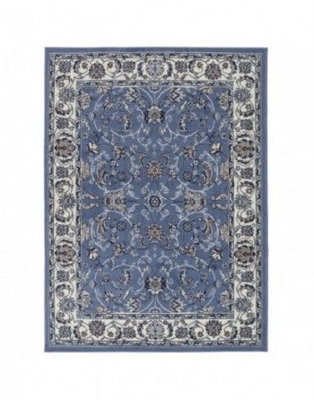 A blue rug with a pattern on it is on a white background.