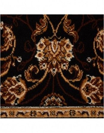 A black and brown rug with a floral pattern