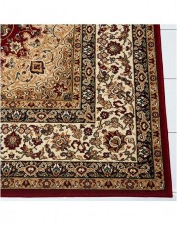 A rug with a red border and a floral pattern