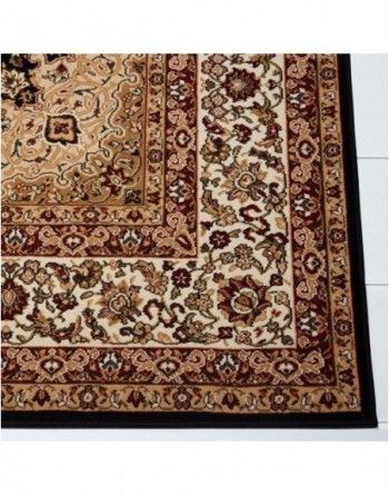 A rug with a floral pattern and a black border