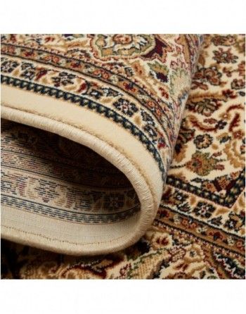 A close up of a rug with a floral pattern on it.