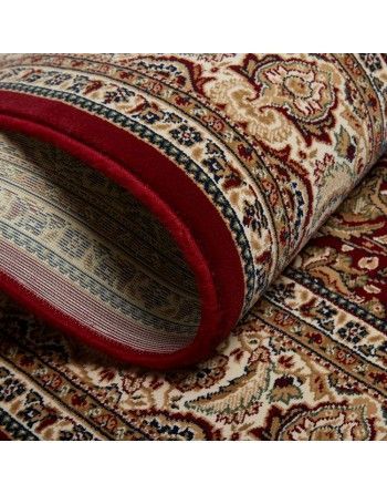 A close up of a rug with a red border on a white background.