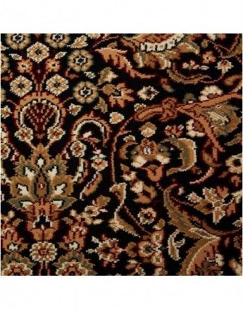 A black rug with a floral pattern on it