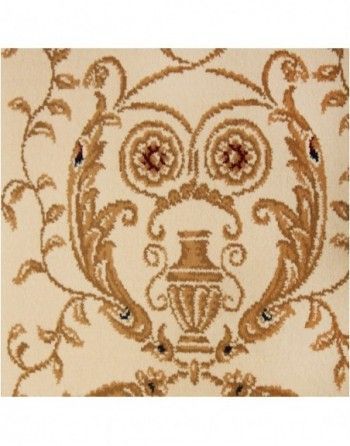 A close up of a rug with a vase on it